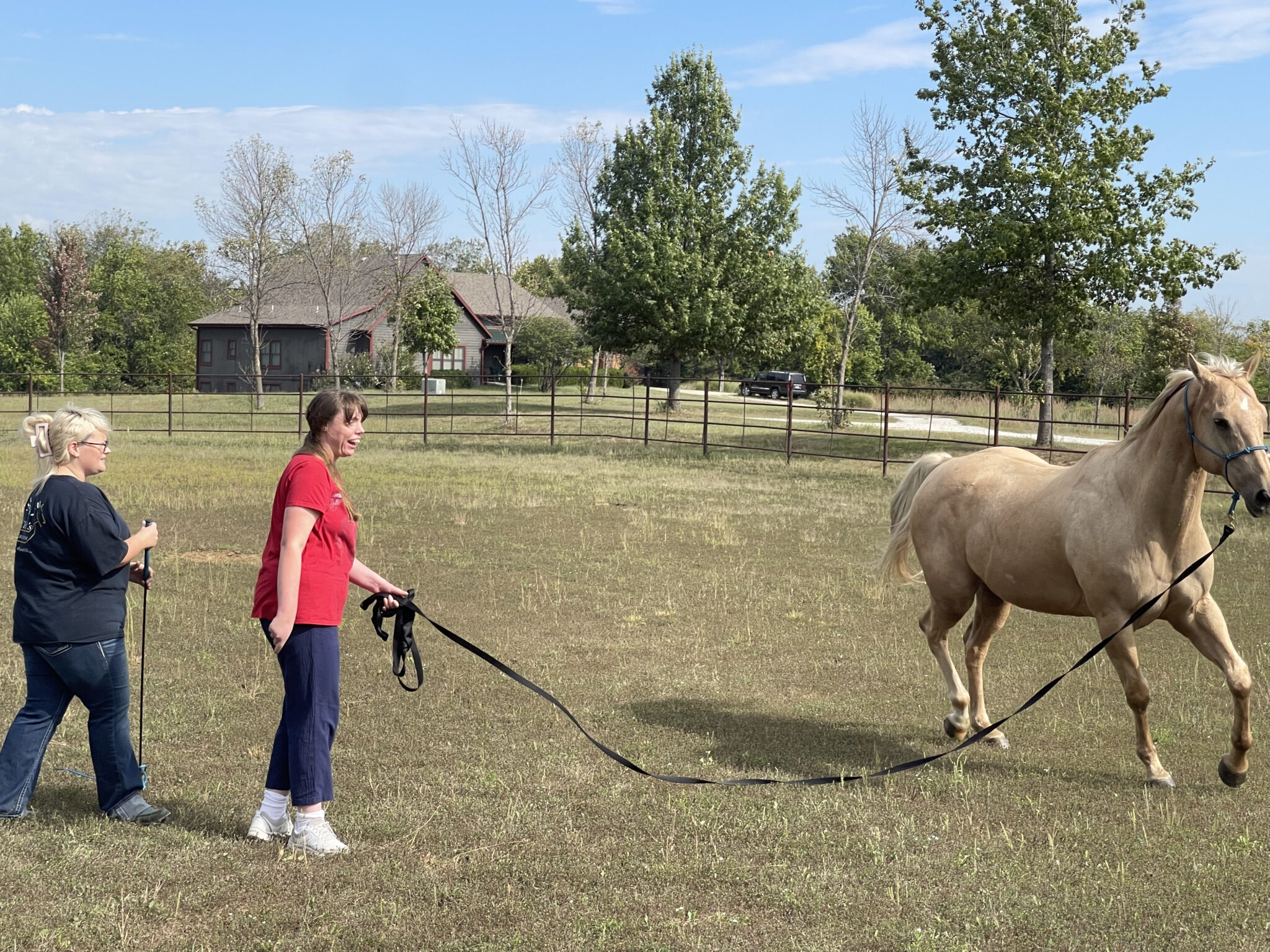 Cheyene and MNF staff spend time with a horse